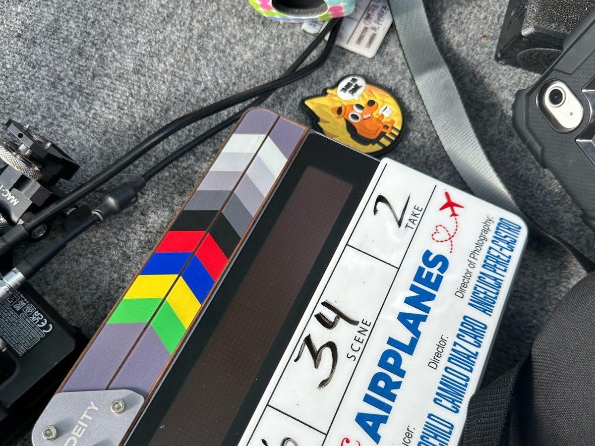 A clapperboard and colour chart waiting on set